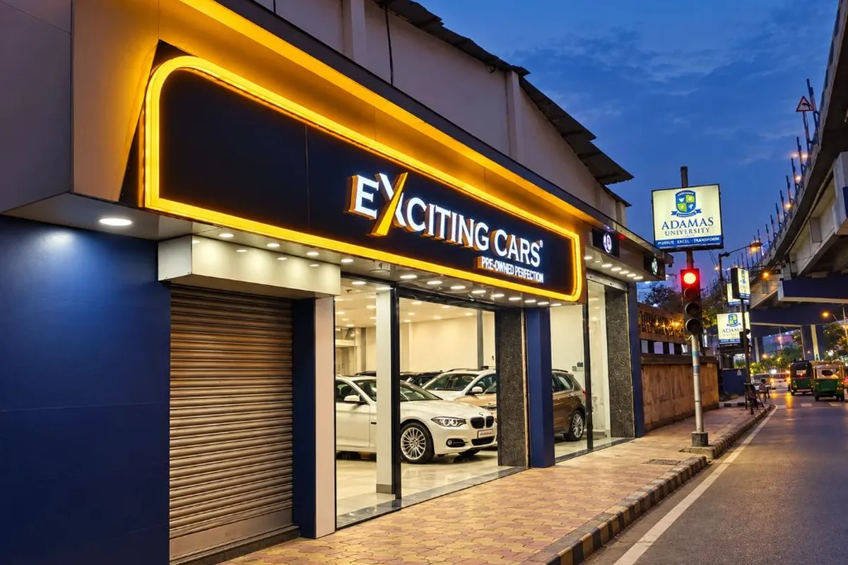 Exciting Cars showroom exterior at dusk, Tiljala Road, Kolkata